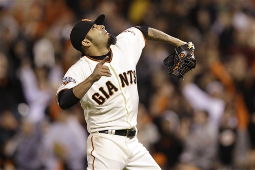 San Francisco Giants pitcher Sergio Romo (54) celebrates after striking out Colorado Rockies' Wilin Rosario to end the ninth inning of a baseball game in San Francisco, Monday, April 8, 2013. The Giants won 4-2. (AP Photo/Jeff Chiu)