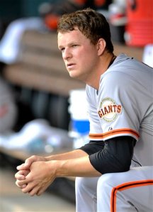 San Francisco Giants starting pitcher Matt Cain looks on from the dugout during the first inning of a baseball game against the Colorado Rockies on Thursday, May 16, 2013, in Denver. (AP Photo/Jack Dempsey)