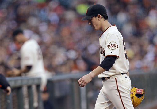 San Francisco Giants starting pitcher Tim Lincecum walks at the end of the second inning where he gave up two home runs to the Cincinnati Reds during a baseball game on Monday, July 22, 2013, in San Francisco. (AP Photo/Marcio Jose Sanchez)