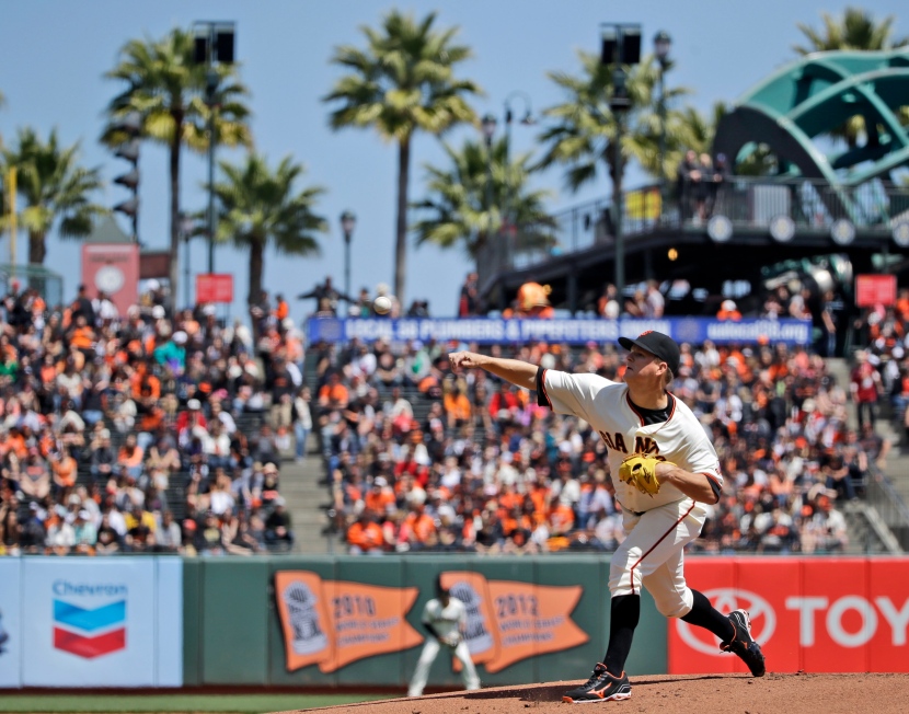 San Francisco Giants starting pitcher Matt Cain throws to the Colorado Rockies during the first inning of a baseball game on Saturday, April 12, 2014, in San Francisco. (AP Photo/Marcio Jose Sanchez)