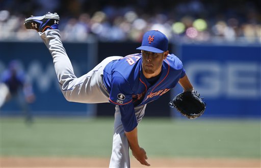 New York Mets starting pitcher Zack Wheeler follows through with a pitch against the San Diego Padres in the first inning of a baseball game Sunday, July 20, 2014, in San Diego.  (AP Photo/Lenny Ignelzi)